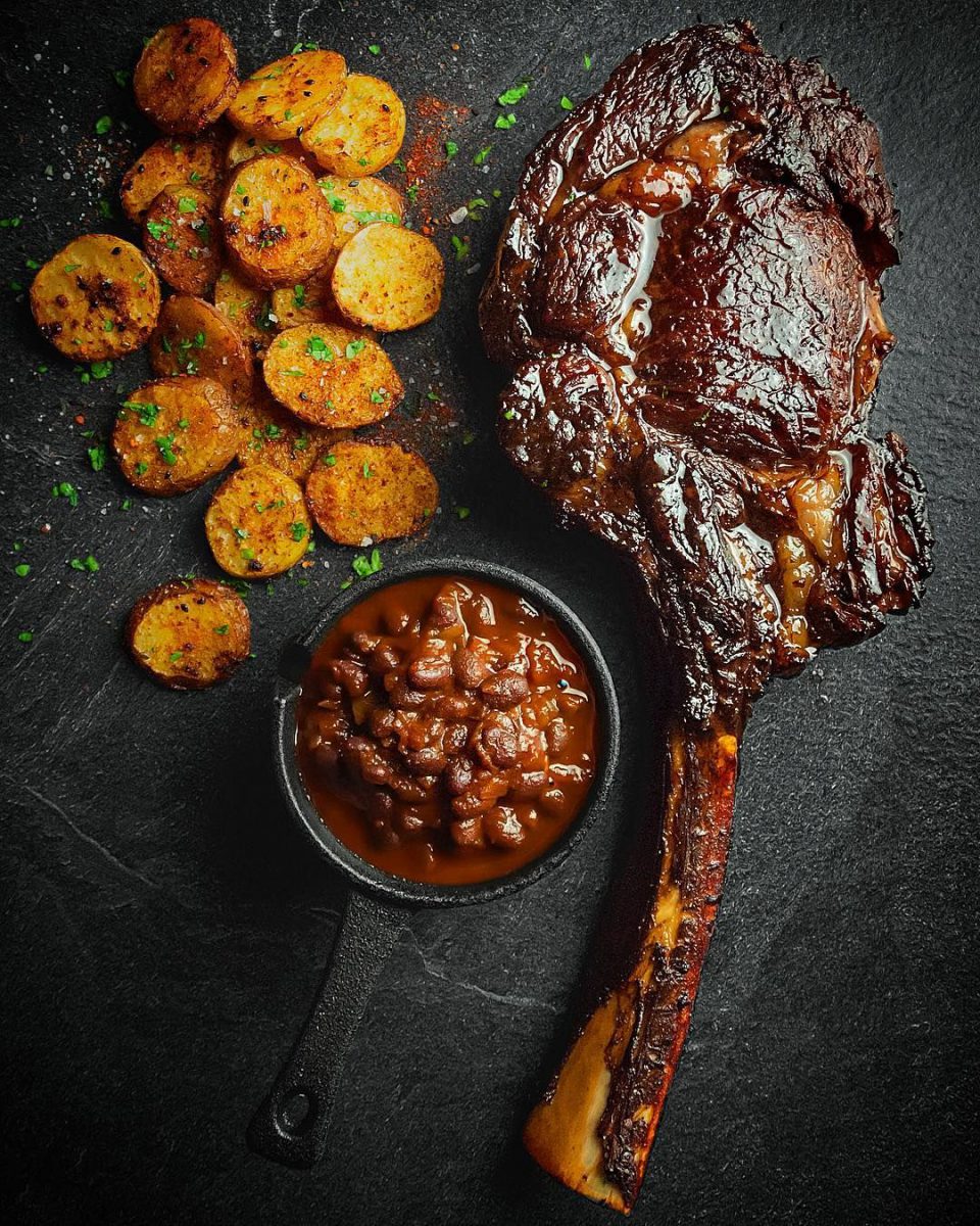 GRILLED TOMAHAWK WITH HARISSA BUTTER AND PAP CHIPS